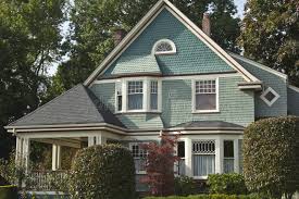 Q1 brick photo 3 A light blue brick house in Seattle, WA with white trim